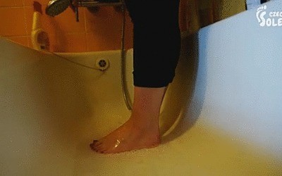 Youthfull Girl Washing And Brushing Her Bare Feet