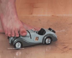 Old Car Under Naked Feet